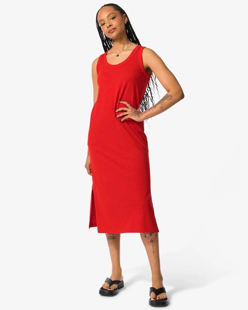 A model poses in a red summer dress from Hema