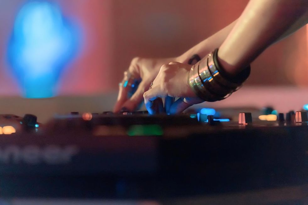 Blue, Electronics, Disc jockey, Hand, Finger, Mixing console, Nail, Technology, Games, Performance, 