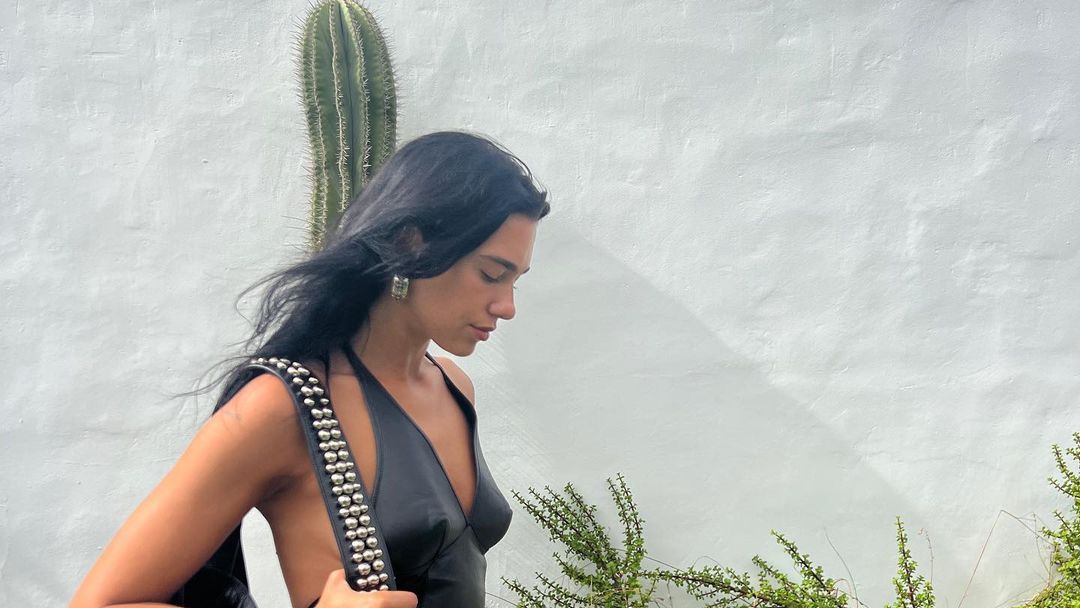 Dua Lipa Wore a Leather Halter-Neck Dress With a Studded Tote Bag