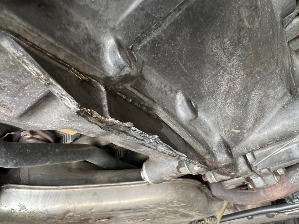 scraped up porsche 911 undercarriage