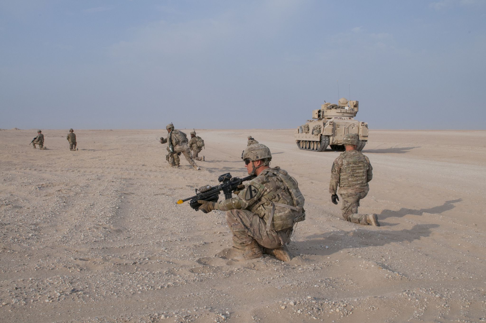soldiers with c company, 1st battalion, 12th cavalry regiment, prepare to move forward during an attack against a simulated compound during an exercise on udari range complex near camp buehring, kuwait, oct 17, 2017 the infantry unit conducted a platoon mounted and dismounted assault on an objective, an exercise that better prepares it to certify for future deployments after it returns to the us us army photo by sgt david l nye, us arcent pao