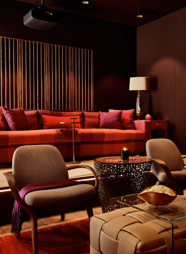 Modern lounge area with a red and brown color scheme.