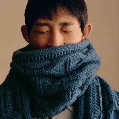 hermes individual wearing a textured blue scarf