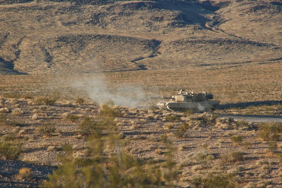 us army soldiers assigned to 1st brigade combat team, 1st cavalry division, defend their position in an m1a2 abrams tank in conjunction with a simulated attack during decisive action rotation 18 02 at the national training center in fort irwin, calif, nov 22, 2017 us army photo by spc dana clarke, operations group, national training center