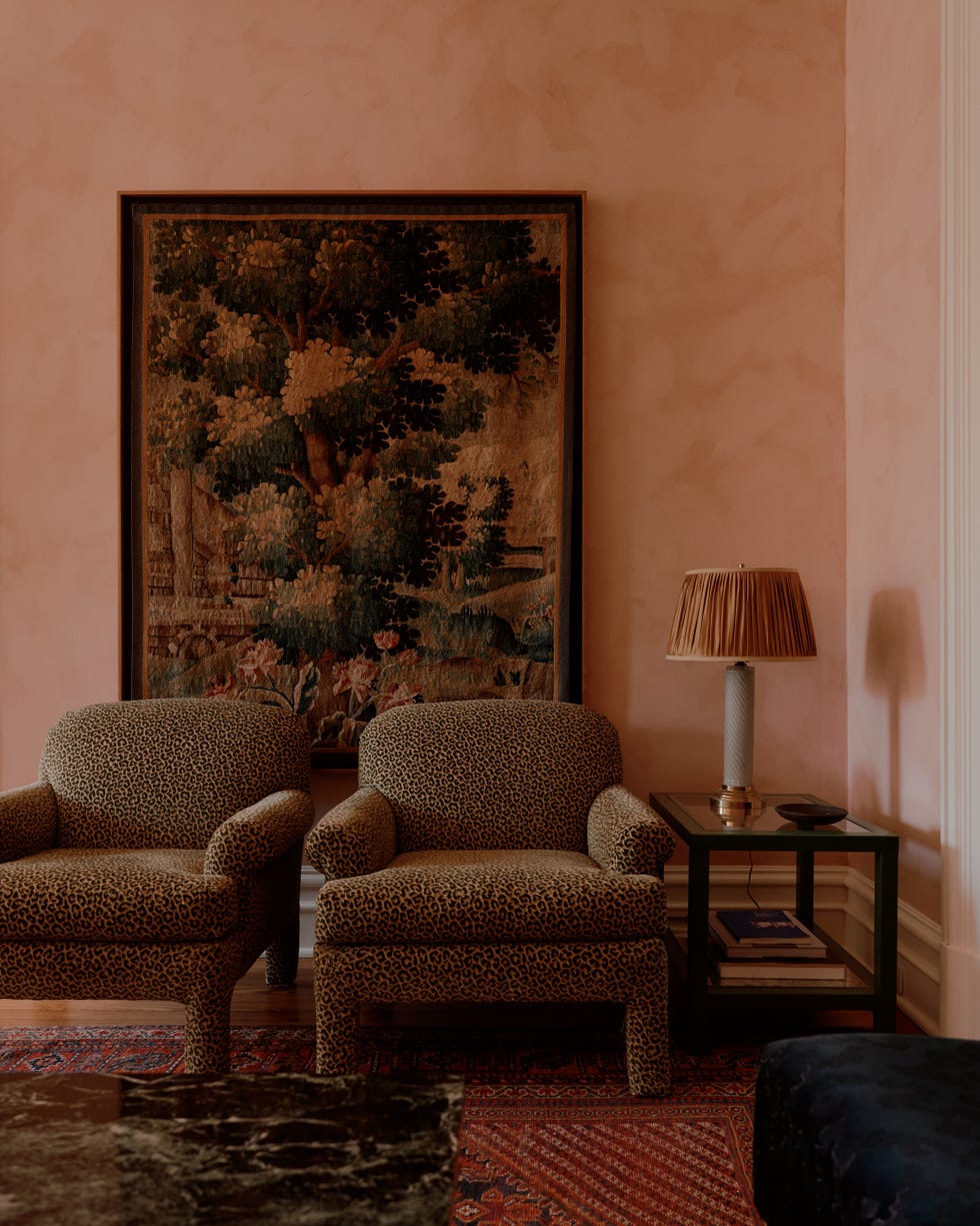 Cozy living room setting with patterned chairs and decorative elements.
