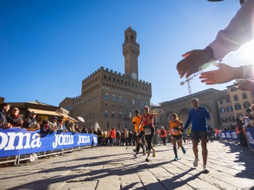 runners participating in a race near a historic building