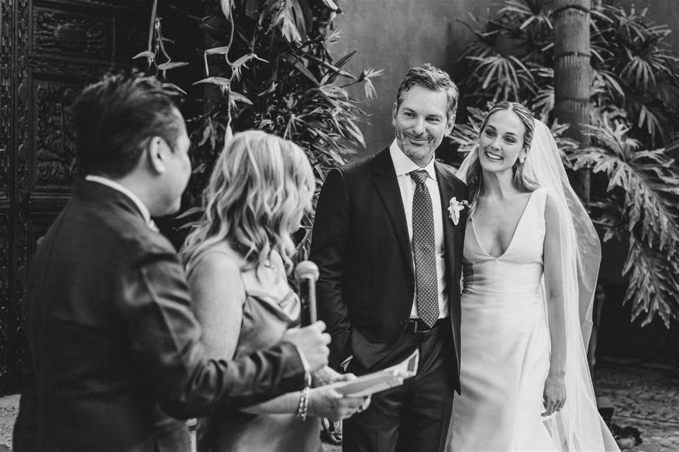 wedding ceremony scene with a couple and officiant