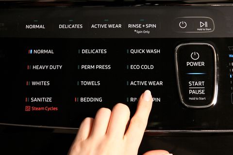selecting a rinse and spin cycle to clean a washing machine