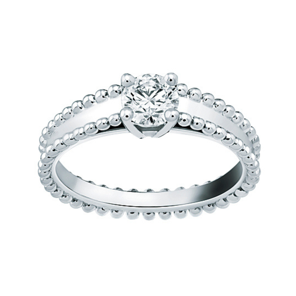 a silver ring with diamonds