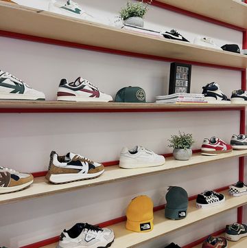 a shelf with shoes and hats