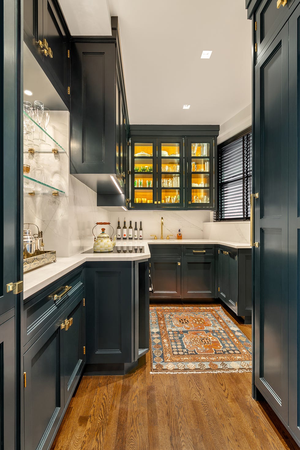 galley kitchen with teal cabinetry