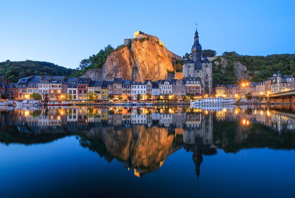 the citadel, the collegiate church and the meuse river at dinant, belgium