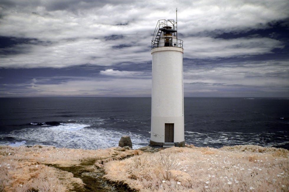 a lighthouse on a beach
