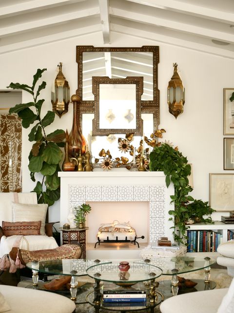 fireplace mantel gold mirrors and sconces