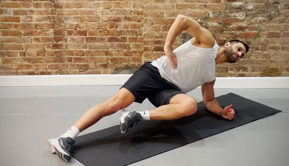 person performing a workout exercise on a mat