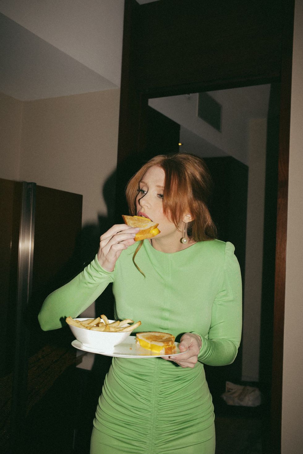 a woman eating a sandwich