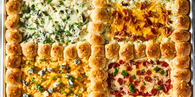 dip in 4 sections surrounded by pull apart biscuits on a tray