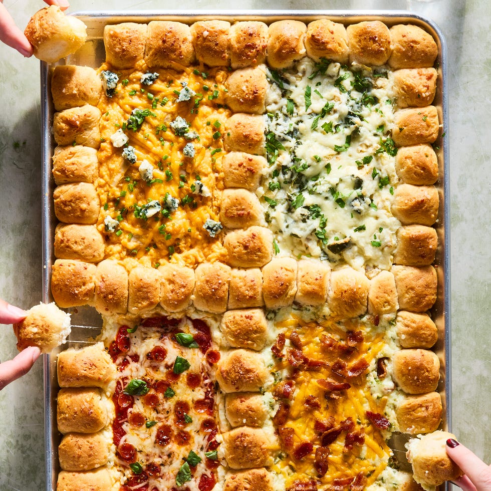 dip in 4 sections surrounded by pull apart biscuits on a tray