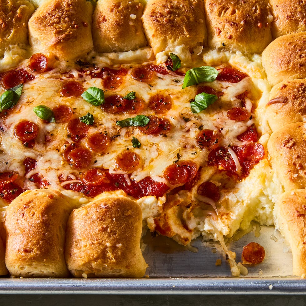 dip in 4 sections surrounded by pull apart biscuits on a tray