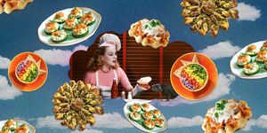 a woman sitting at a table with food on it