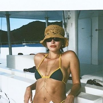hailey bieber in a bikini on a boat