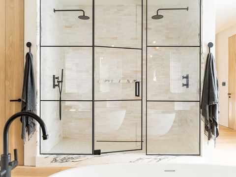 shower, black trim with glass, black shower heads, double shower