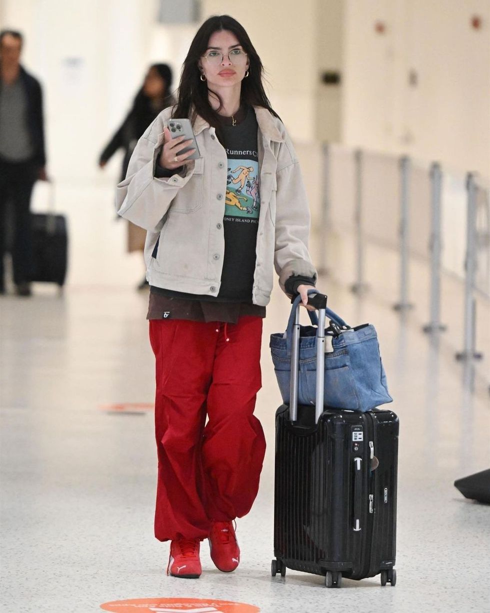 a woman standing with luggage