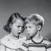 1950s boy girl head to head angry facial expressions argument fight 1950s boy girl head to head angry facial expressions argument fight