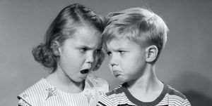 1950s boy girl head to head angry facial expressions argument fight