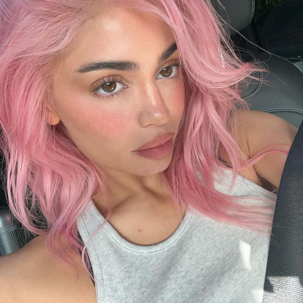 a woman with pink hair