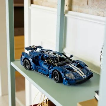 a blue toy car on a table
