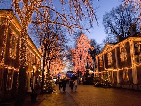 The aroma of toasted almonds and glogg heralds the arrival of Saint Lucia to this charming river town illuminated all season long Five million lights glitter on the buildings and on the 700 Christmas trees at Liseberg Amusement Parks Christmas Market Scandinavias largest Choirs sing and sweethearts smooch along a twomile Lane of Light leading to the harbor beginning in December
