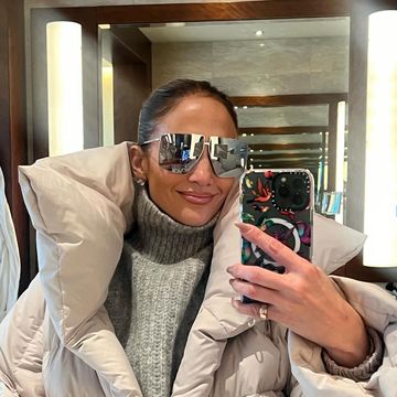 jlo wearing sunglasses and a scarf