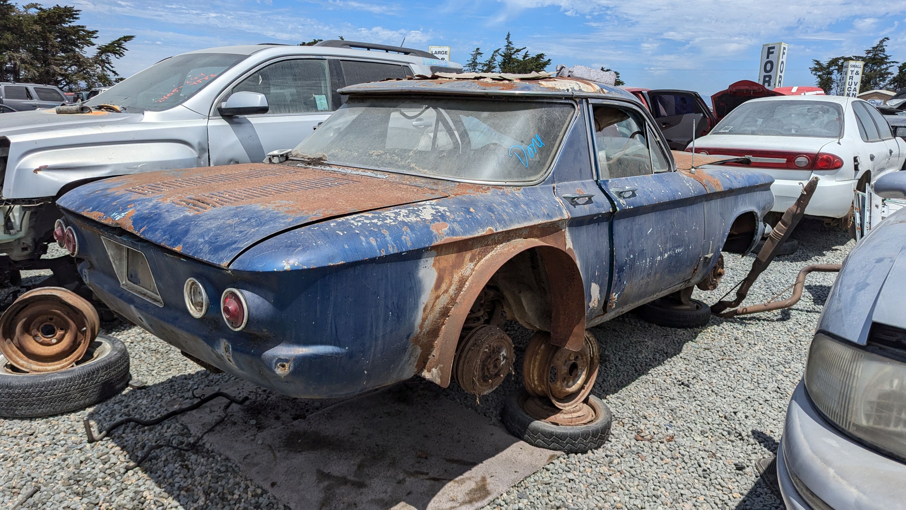 Shorty Chevy Corvair—with 2 Doors, 4 Handles—Is Junkyard
