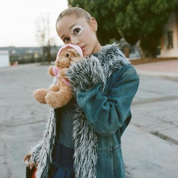 a person holding a stuffed animal