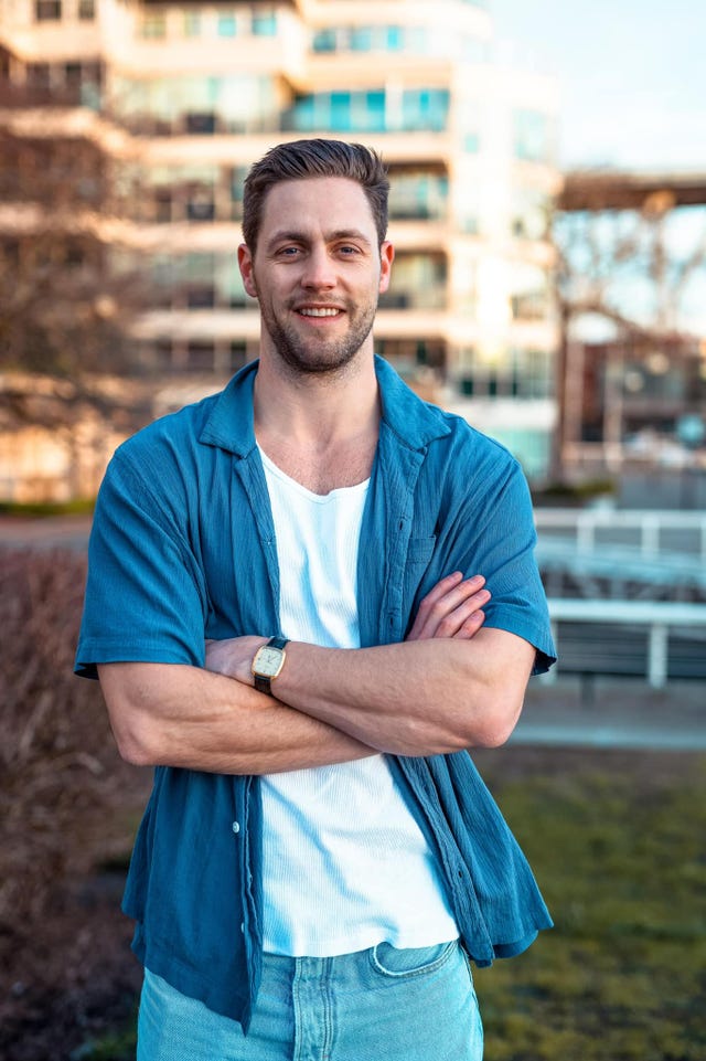 a man folding his arms