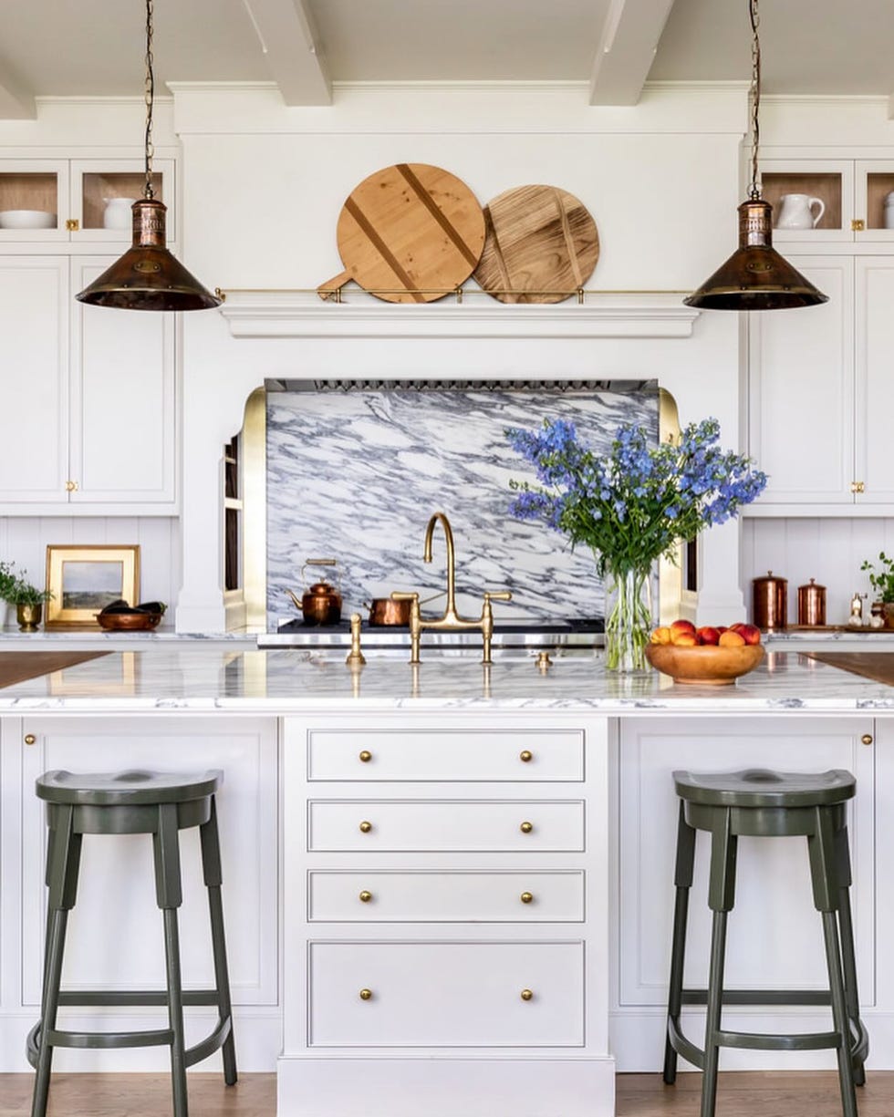 a kitchen with white cabinets and a white counter top a kitchen with white cabinets and a white counter top