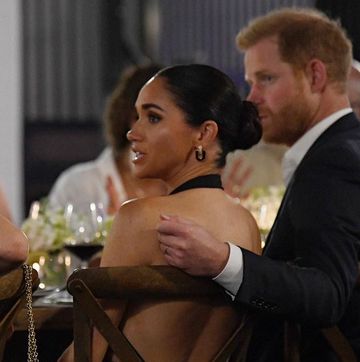 meghan brings the heat in a backless lbd