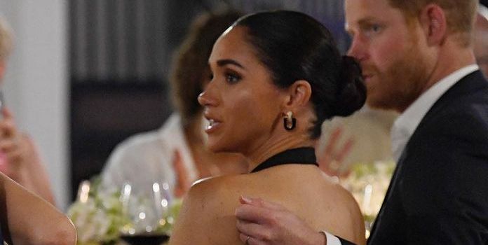 Duchess Meghan’s Unexpected Backless Dress Infuses Some Heat Into Royal Fashion