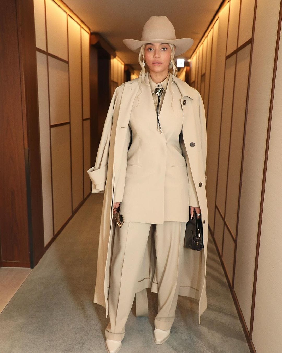 Beyoncé Dresses Up Her Sculpted All-Beige Suit With a Turquoise Bolo ...