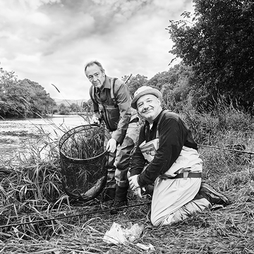 paul whitehouse and bob mortimer pose with a fishing net by a river bbc tv show gone fishing