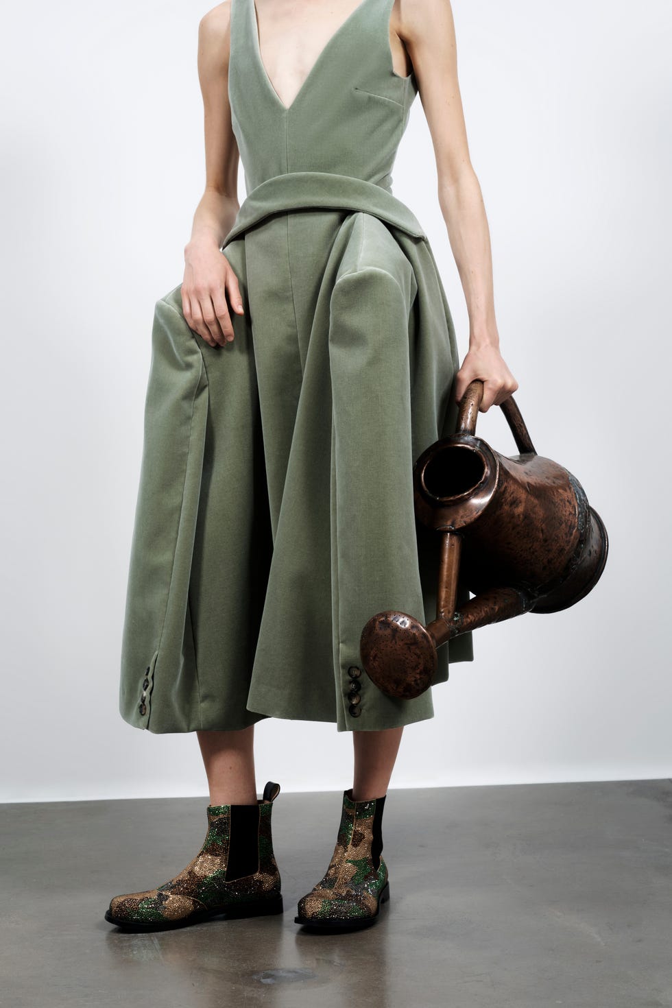 girl in dress with watering can