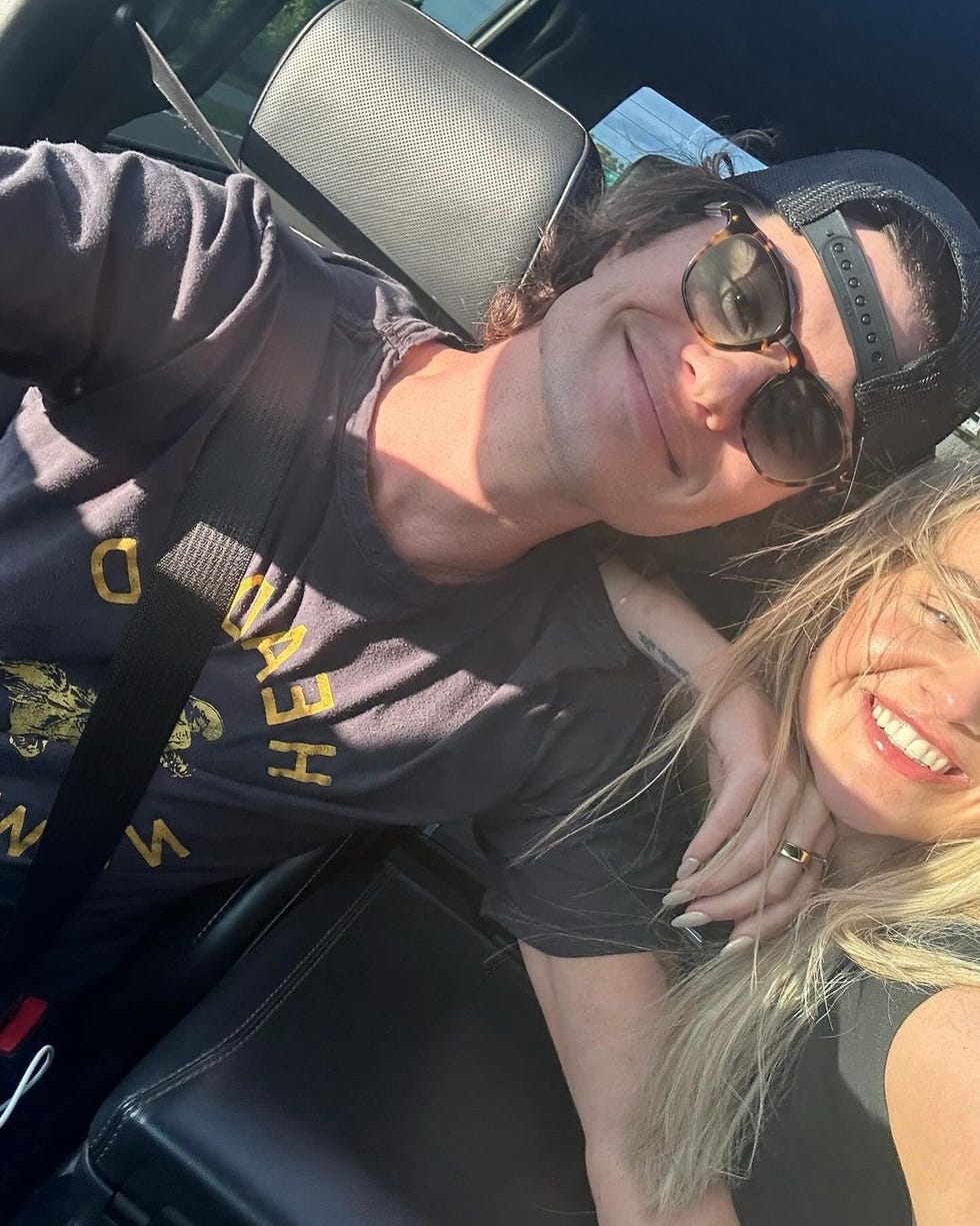 a man and woman in a car