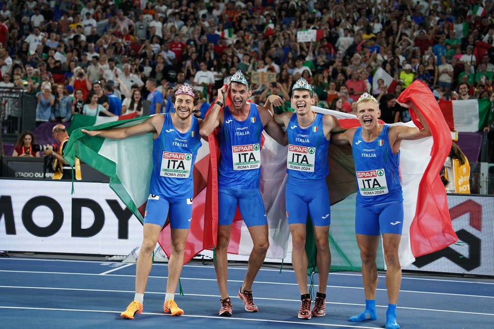 a group of athletes posing for a picture