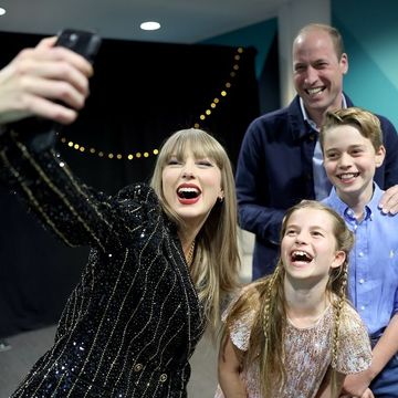 taylor swift posing with prince william, princess charlotte, and prince george during the london eras tour show