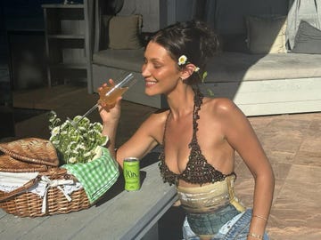 bella hadid wears a bikini top with a corset