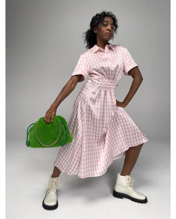 ayo edebiri in a pink and white gingham dress for loewe campaign