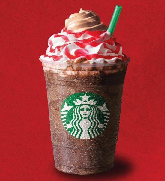 a beverage featuring whipped cream and a drizzle topping