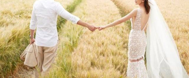 People in nature, Photograph, Wedding dress, Dress, Bride, Grass family, Interaction, Bridal clothing, Grassland, Grass, 