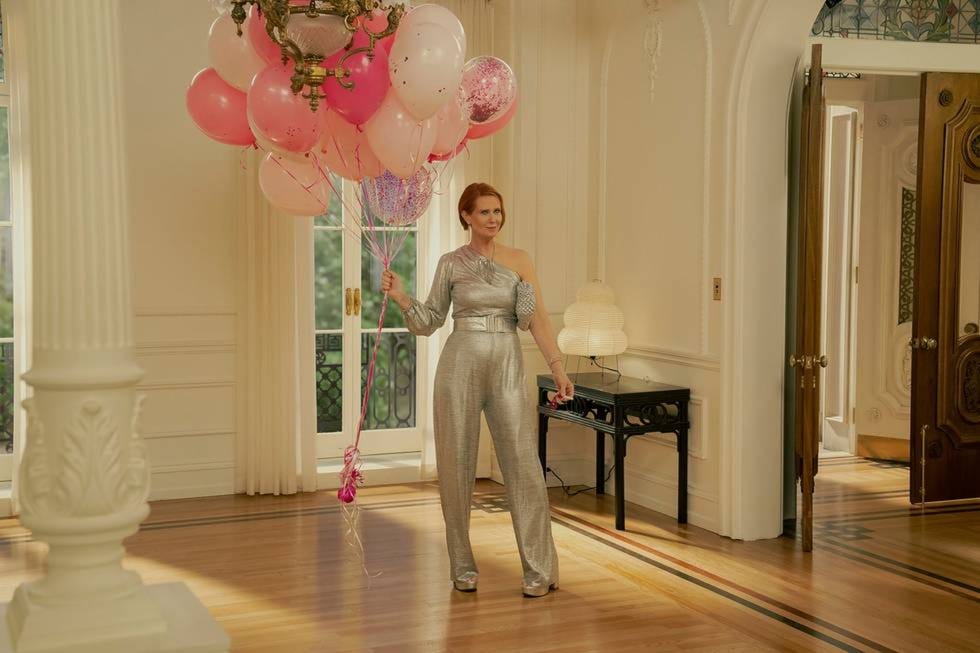 Celebratory scene with balloons and elegant decor.